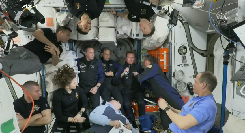 SpcPlcyOnline's tweet photo. Ax-1 commander Michael Lopez-Alegria (who's on his 5th spaceflight) is pinning his colleagues with a specially designed pin from the Association of Space Explorers to commemorate their becoming astronauts 582, 583 and 584. https://t.co/XmaFWXYPIB