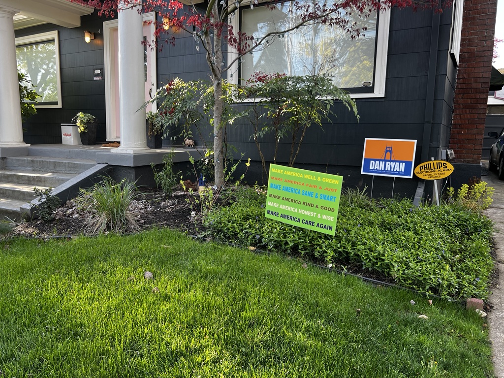 Not pictured, the In Our America sign on the other dies of the yard.