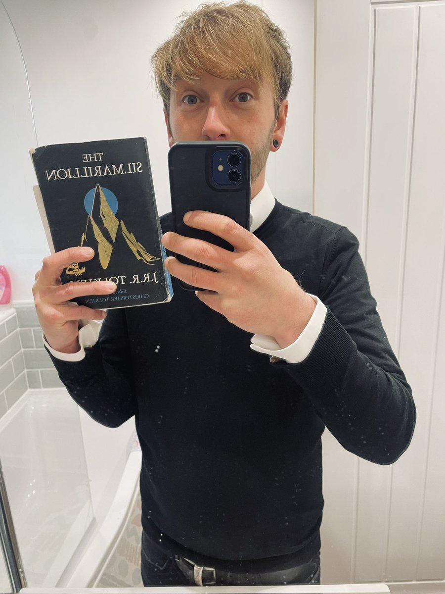 C_S_Robbins's tweet photo. Finally, after months and months of painstaking work, I have finished The Silmarillion. A true work of genius, but also the literary equivalent of running a marathon in high heels whilst piggy-backing a fully grown oliphaunt. I’m even wearing a shirt in celebration! 😮‍💨 https://t.co/a0Aa0oyYxB