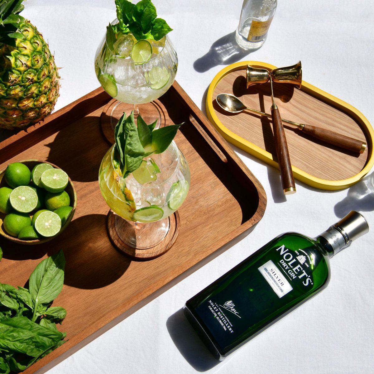 NOLETSGins's tweet photo. How do you G+T? 

For #NationalGinandTonicDay we’re garnishing with 🍍 basil &amp; lime. 

#Gin #tonic #gintonic #NOLETS https://t.co/o3T3om2qw9