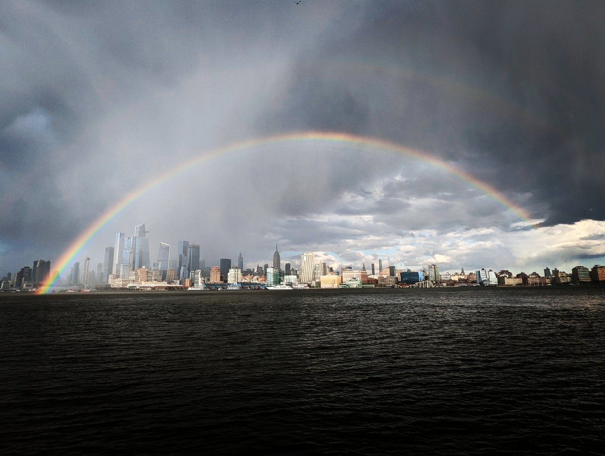GaryHershorn's tweet photo. A rainbow forms over midtown Manhattan and the Empire State Building Saturday evening in New York City #newyork #newyorkcity #nyc @EmpireStateBldg #rainbow @agreatbigcity https://t.co/YbkCaQFi0J