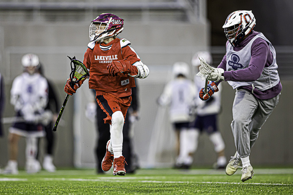 vid3design's tweet photo. Looking for signs of spring, because there have been none in the weather. Found it at TCO Performance Center in scrimmage between @NorthLacrosse and Orono. https://t.co/6TwtRmIQKK