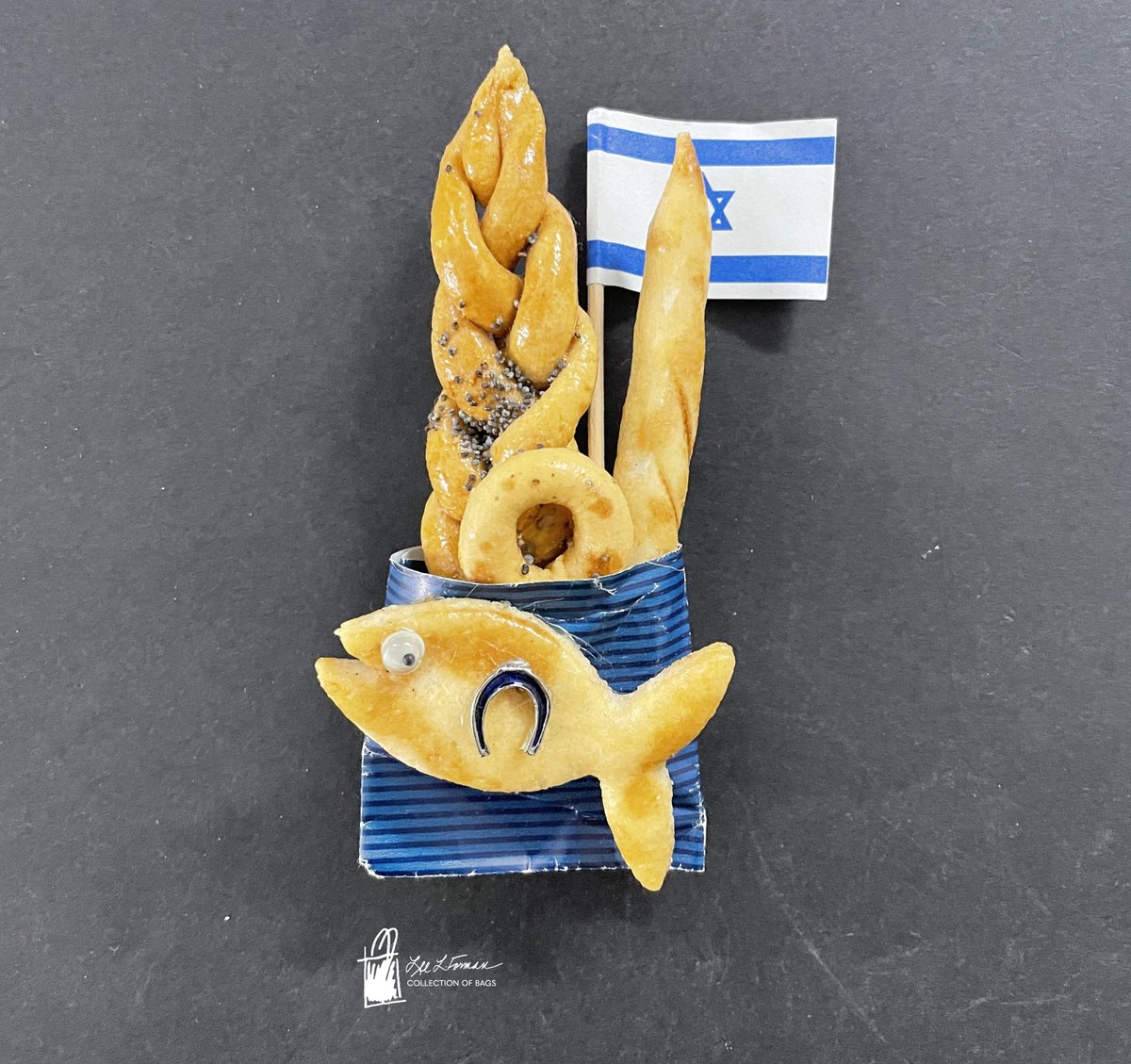103/365: Does food ever remind you of past travels? This miniature magnet is designed to remind the viewer of delicious breads eaten during travel to Israel, including challah, bagels, and baguettes.