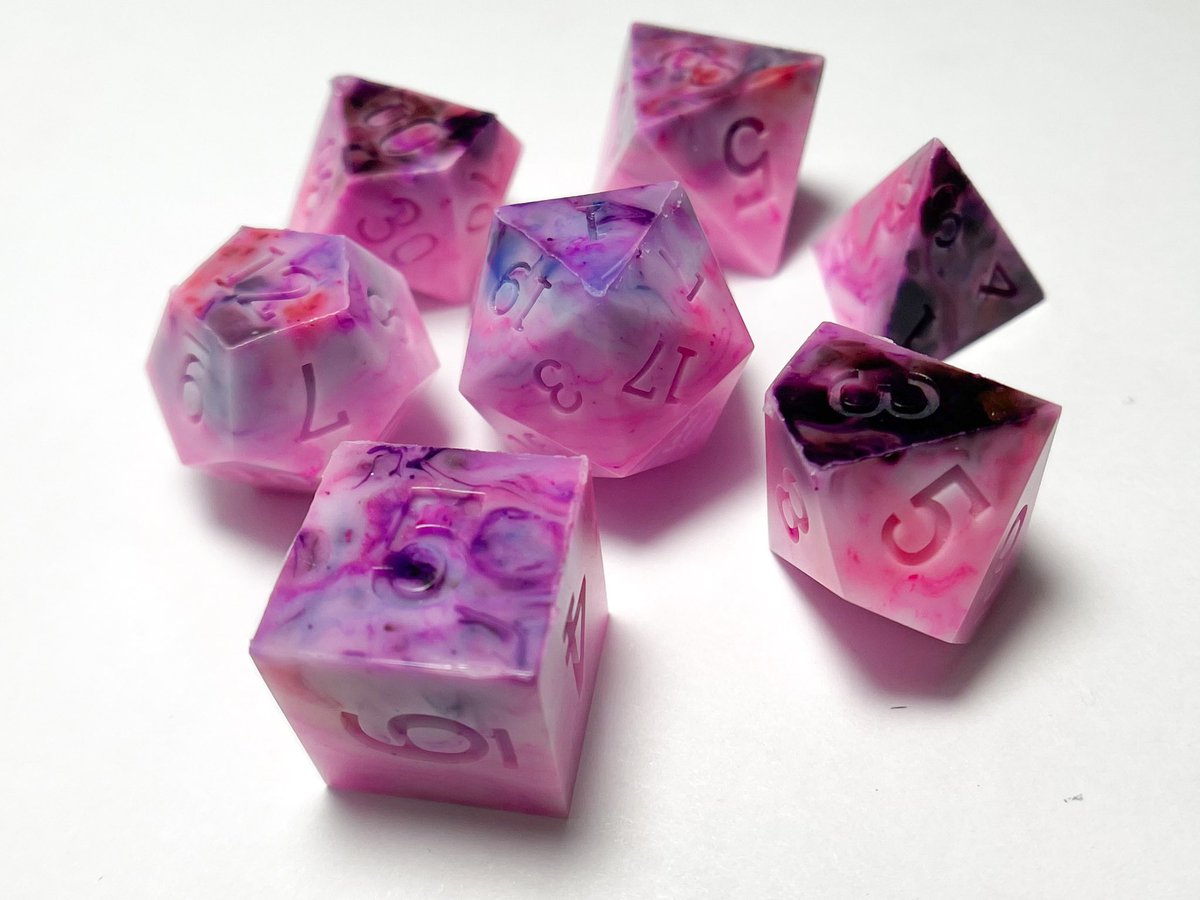 I tried to invent a new technique and though it still needs a ton of refining, it made this really cool set on the first try. 

#Dnd #dice #ttrpg #resinart #handmadedice