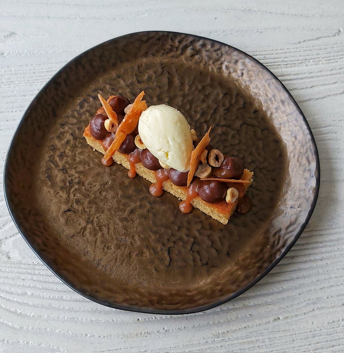 Ferrero Rocher' cake, vanilla ice cream, brittle, salted caramel glaze.