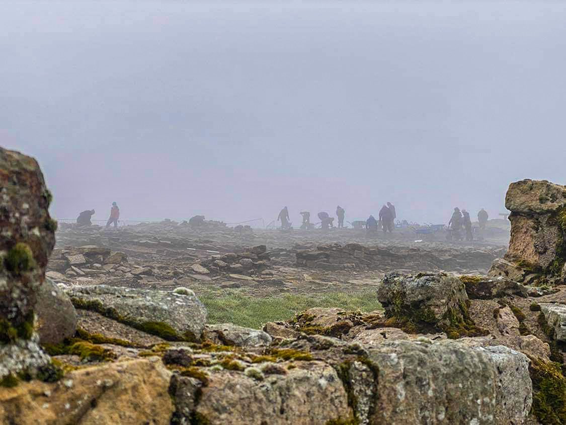 VindolandaTrust's tweet photo. Diggers in the mist! The Vindolanda 2022 excavation season is underway. Unfortunately the beautiful weather has left us temporarily but that won’t stop us! #Vindolanda https://t.co/tjcgBVCd71