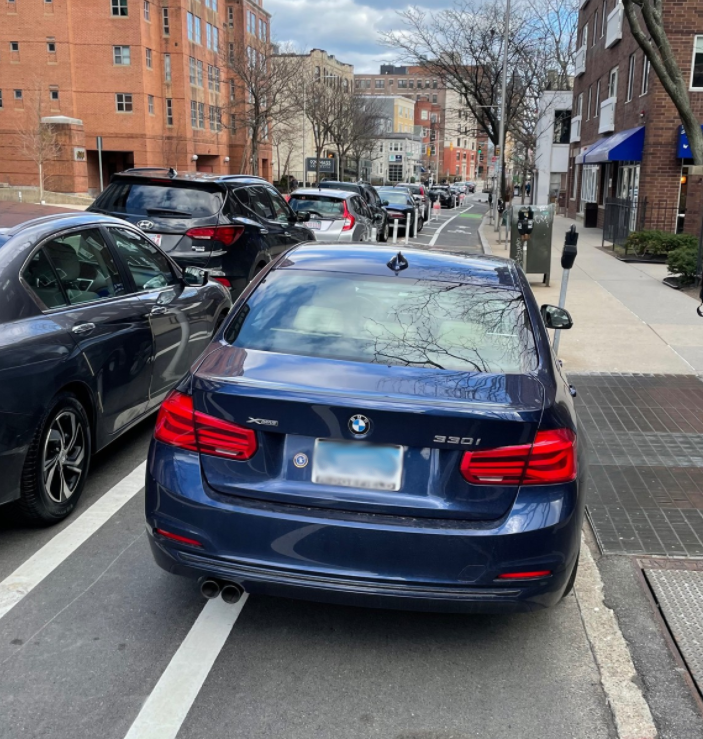 CambridgePolice's tweet photo. In Cambridge, drivers can be issued a $50 violation for obstructing a designated bicycle lane. 

Drivers who block bicycle lanes can cause hazards for people who bike, walk and drive, as cyclists may be required to move unpredictably into traffic. https://t.co/Ap1U0mAqRv