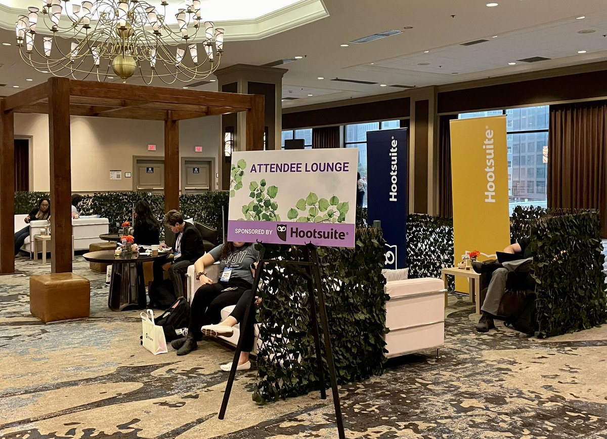 TimTreacy's tweet photo. Come say hi to me in our @hootsuite lounge at #GSMCON2022! There are plenty of cosy couches and armchairs for you to relax and chill on. Grab a coffee and come say hello!🦉 https://t.co/iRABfU3xri