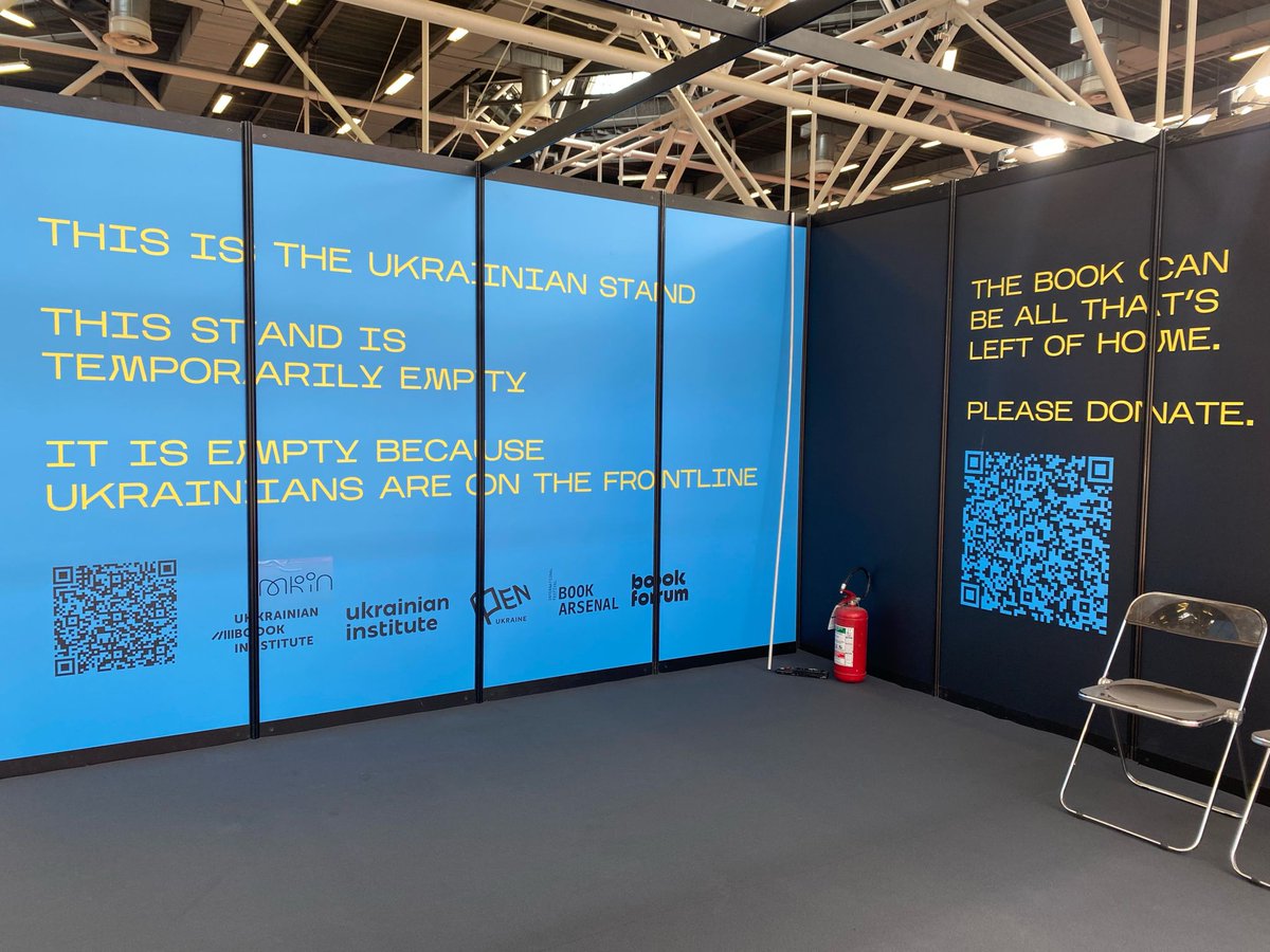 TsurkanKate's tweet photo. At the Bologna Children's Book Fair. 

"This is the Ukrainian stand. This stand is temporarily empty. It is empty because Ukrainians are on the frontline." https://t.co/SM1icLuUAK