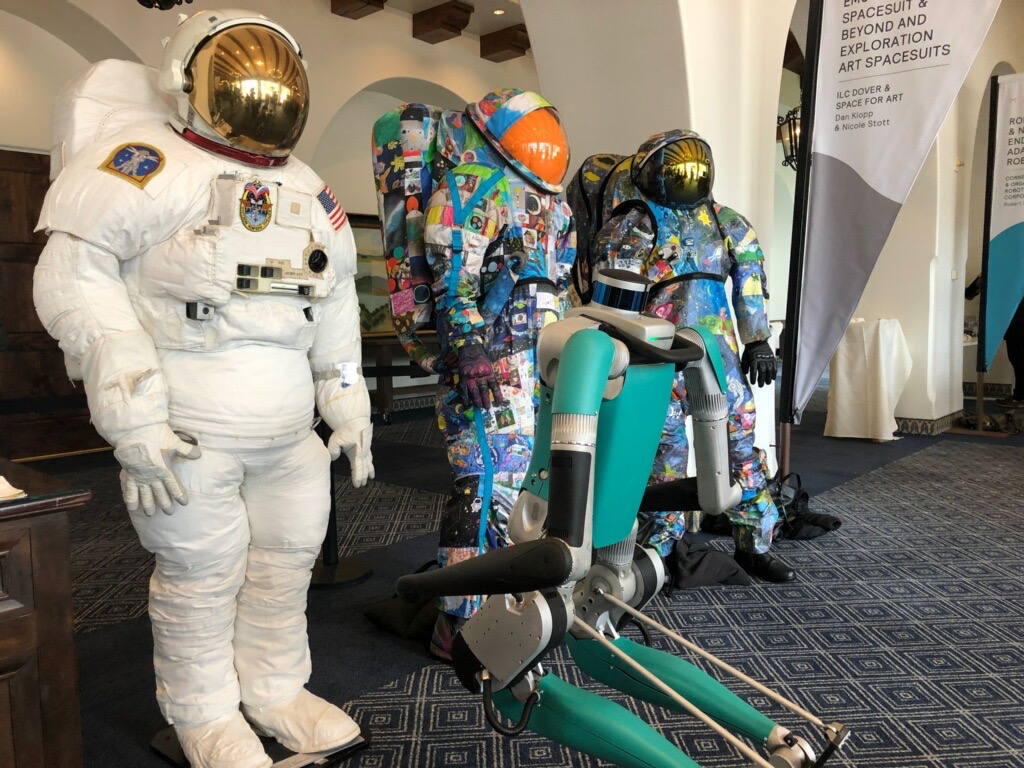 ilcdoverastro's tweet image. We were honored to be invited to the #MARSConference this year, alongside Dava Newman and @astro_nicole, to present our work on advanced #spacesuit development. One of the robots at the conference even came by to "have a look" at the EMU and @SpaceForArtFoun spacesuits.