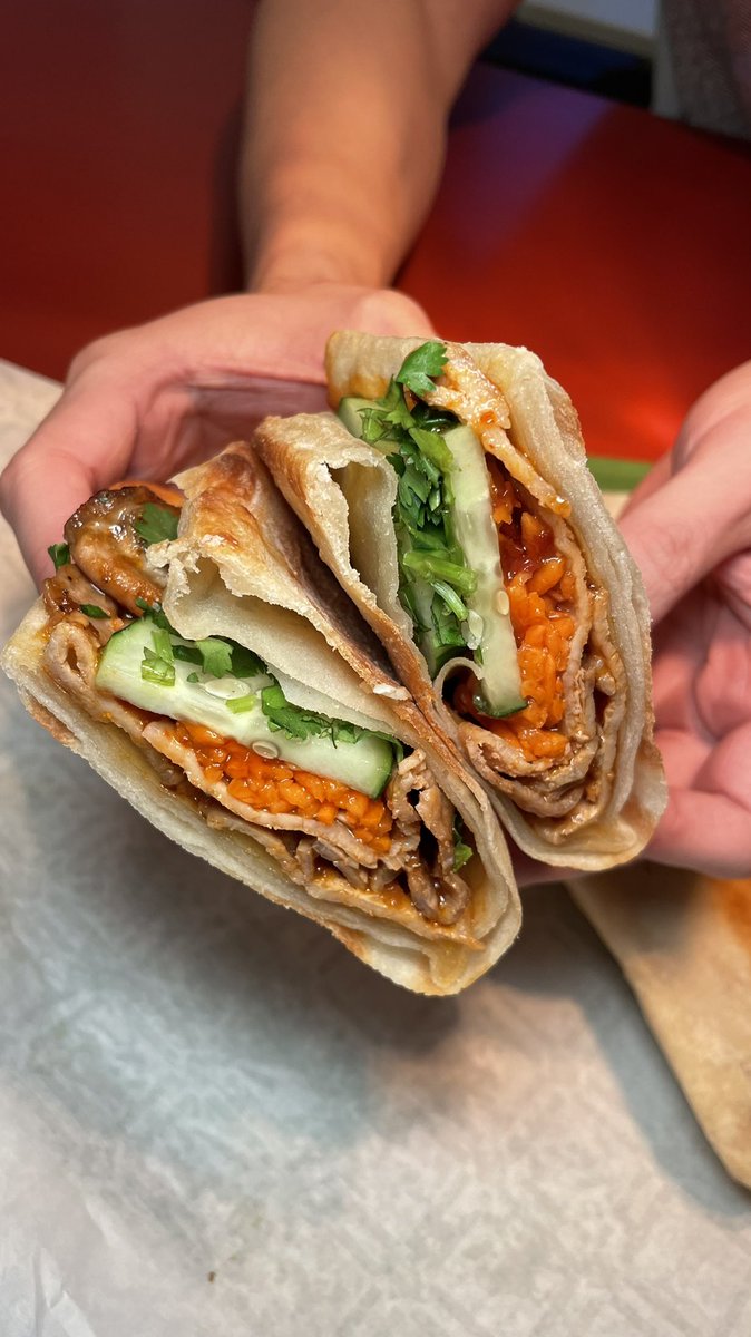foumami's tweet photo. Our Spicy Grilled Pork Loin sandwich packs layers of delicious flavors that'll explode in your mouth w/every bite! Grilled red pepper &amp; garlic marinated lean pork loin, pickled carrots, cucumber, cilantro, red chili sauce on hand-made Shao Bing bread. Stop by #Foumami for #lunch! https://t.co/rRmX37oN0f