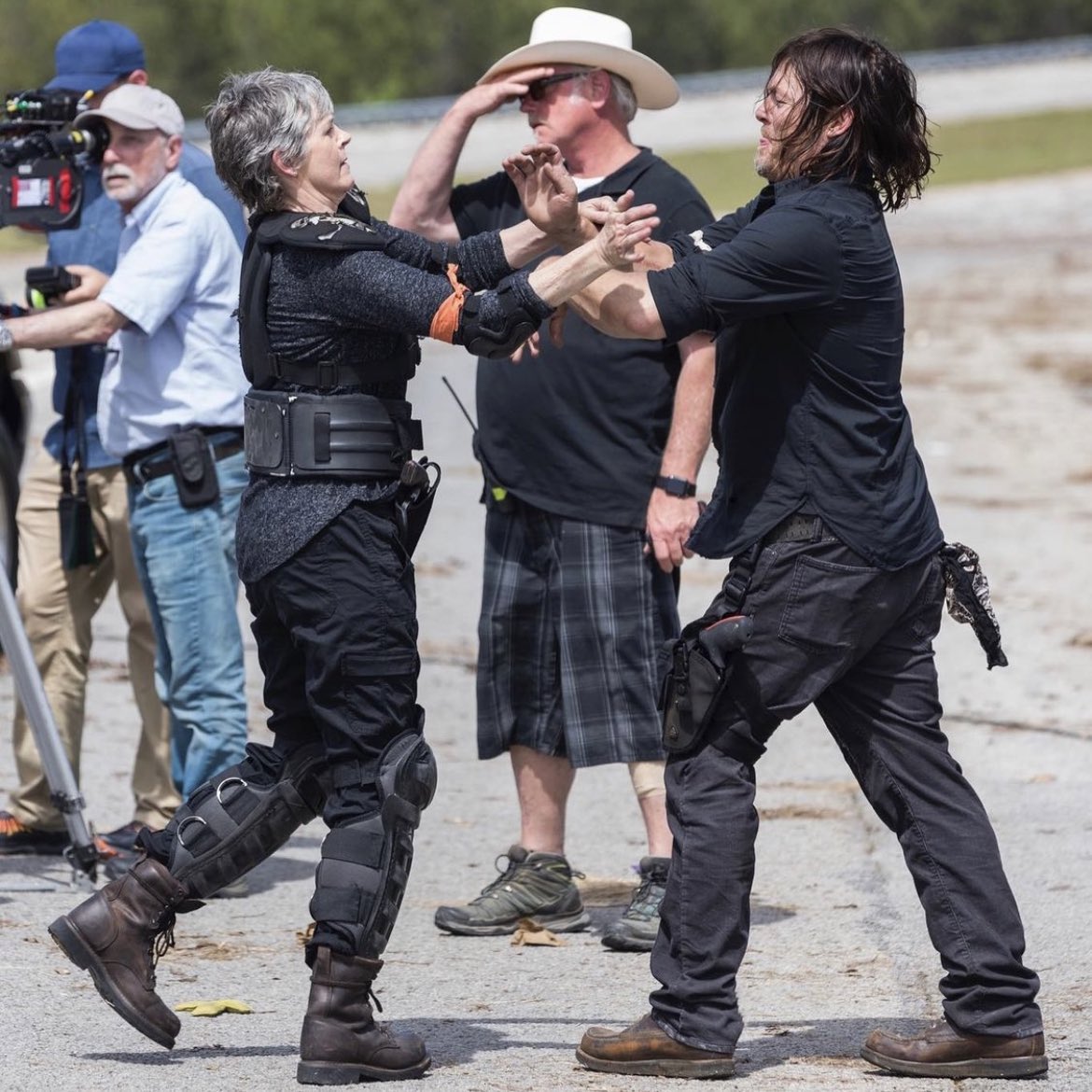 reidstheory's tweet photo. Norman Reedus and Melissa Mcbride having what looks like a slap fight is my new favourite photo https://t.co/8ddoVzkE6I