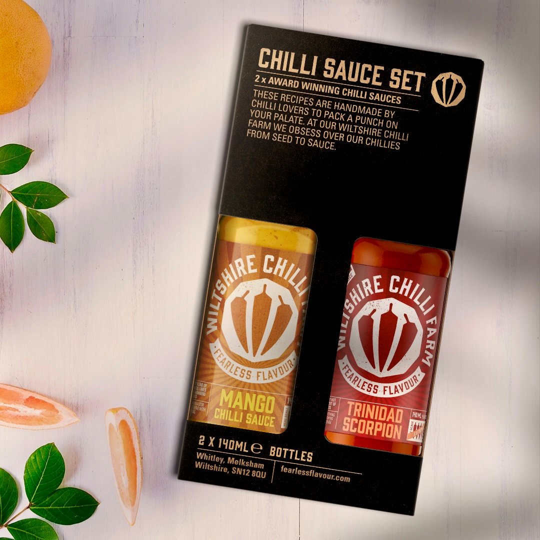 This limited edition gift box contains a fusion of deliciously exotic flavours and heat. Succulent mangos cut with lime, garlic &amp; habanero, compliment the glorious heat of Trinidad Scorpion. Lose yourself in the heady taste of summer🌶️☀️ justchillies.co.uk/product/mango-…