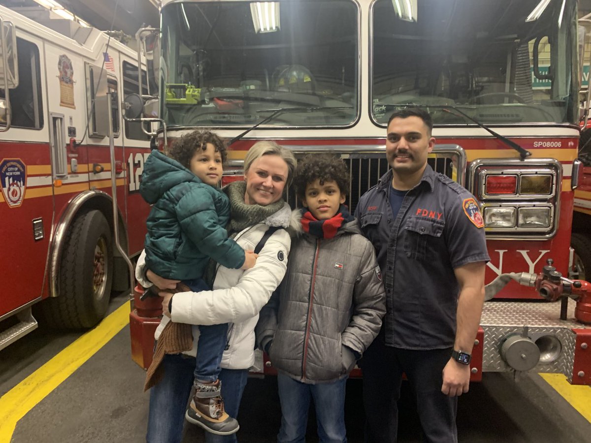 FDNY's tweet photo. Last night, the Gapa family reunited with FDNY Firefighters from #Engine298, #Ladder127 and #Battalion50 after a fire broke out in their building earlier this month. They met with Firefighter Philip Scarfi of Engine 298 who assisted the family off the fire escape. https://t.co/anSVcnzVA1