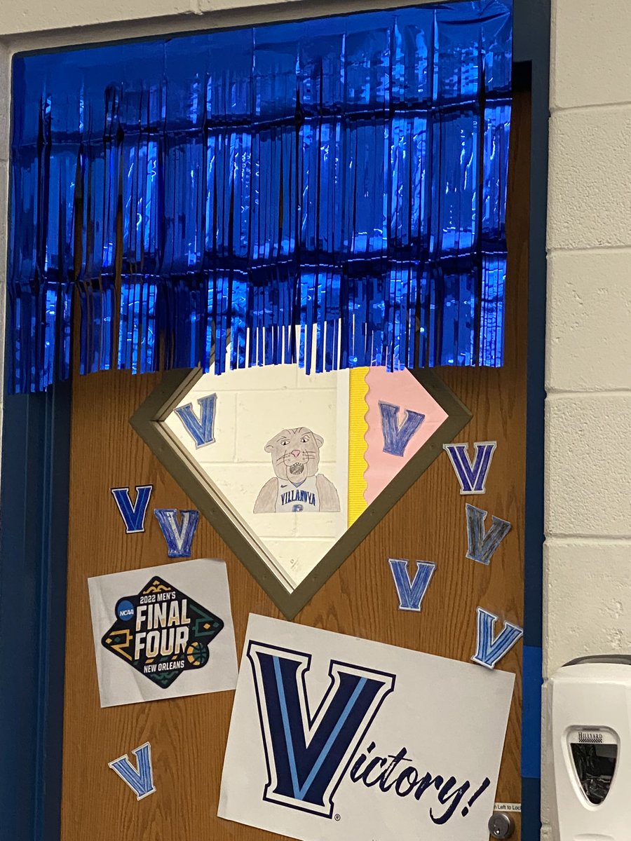 DeepaMccabe's tweet photo. This teacher can’t make it to NOLA for the #FinalFour so my students and I brought the madness to our classroom by decorating the door for @NovaMBB! #LetsMarchNova #OnceAWildcatAlwaysAWildcat #ClassOf1999 #ClassOf2025Mom https://t.co/x60CxjI8IG