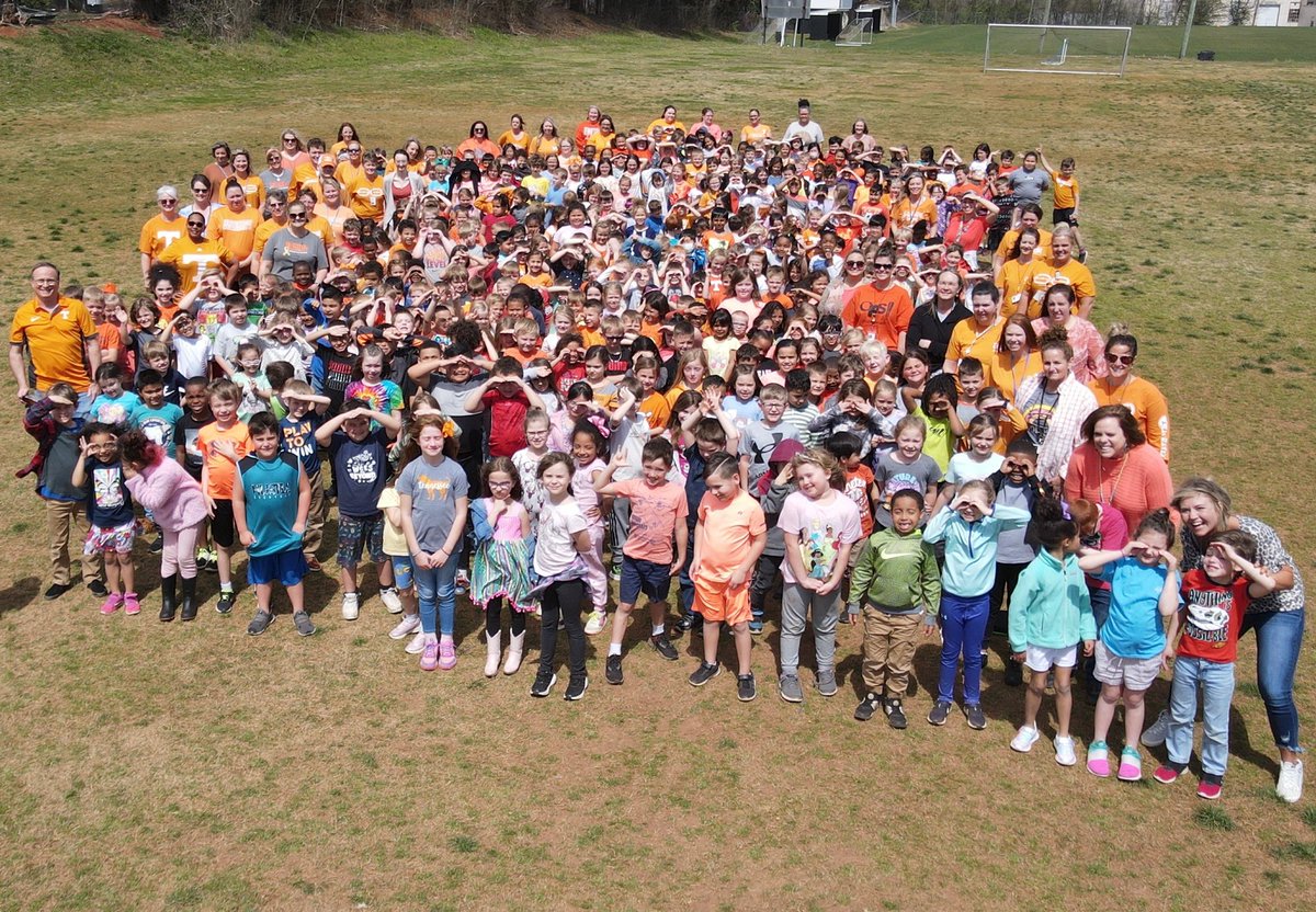 ACS students and staff wearing ORANGE in memory of Neyland. #ExcellenceIs #TeamNeyland