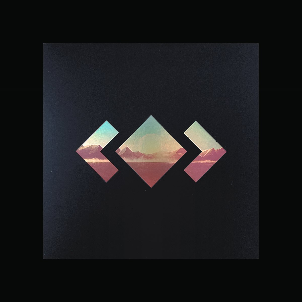 madeon's tweet image. The O-Card is cutout at the front and embossed in the back.