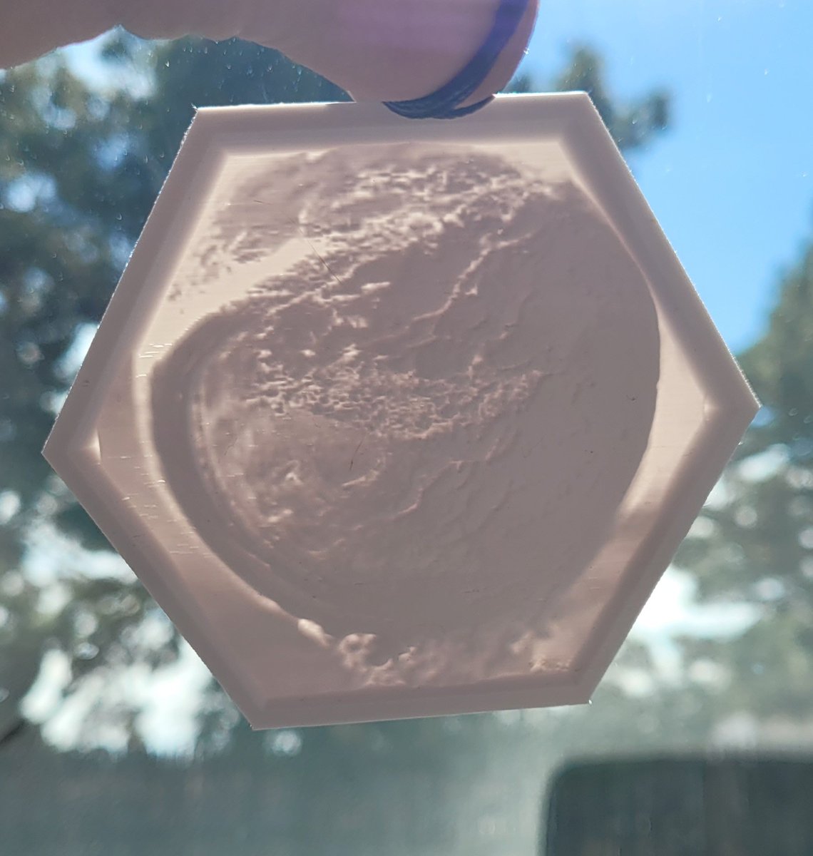 contrive3d's tweet photo. The World Breaking Apart (@ContrastiveNFT) printed into a rearview mirror/window hanger lithophane. 

These pictures don't do it justice either. 🔥🔥🔥🔥

#3D #3dprinted #3dprint #3dprinter #lithophane #3dmodels #ima3dprinter #SmallBusiness #Lubbock #lubbocktx #shallowatertx https://t.co/1uk6x748vV