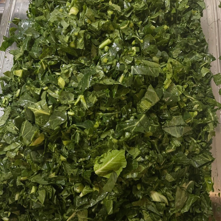 Prepping some yummy collard greens.  You know these will make you 'Smile from the Belly Up!'