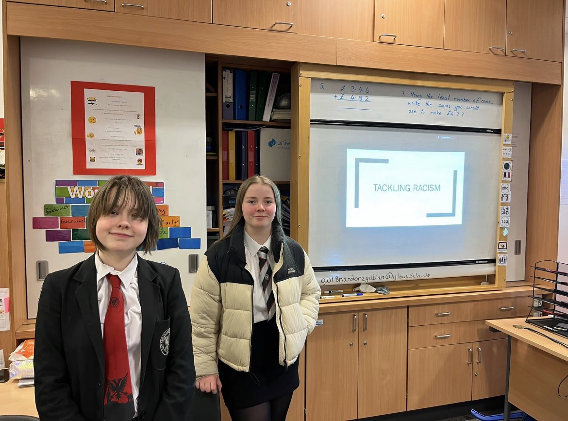 LGS1183's tweet photo. Two of our brilliant Equality Ambassador team, Eliza and Holly, delivered a PSE lesson to S1 today about tackling racism. The whole team have worked hard to develop this lesson which was well received by the class. #TeamLGS #Equality #CelebrateDiversity #ShowRacismTheRedCard https://t.co/6plKL7Lwml