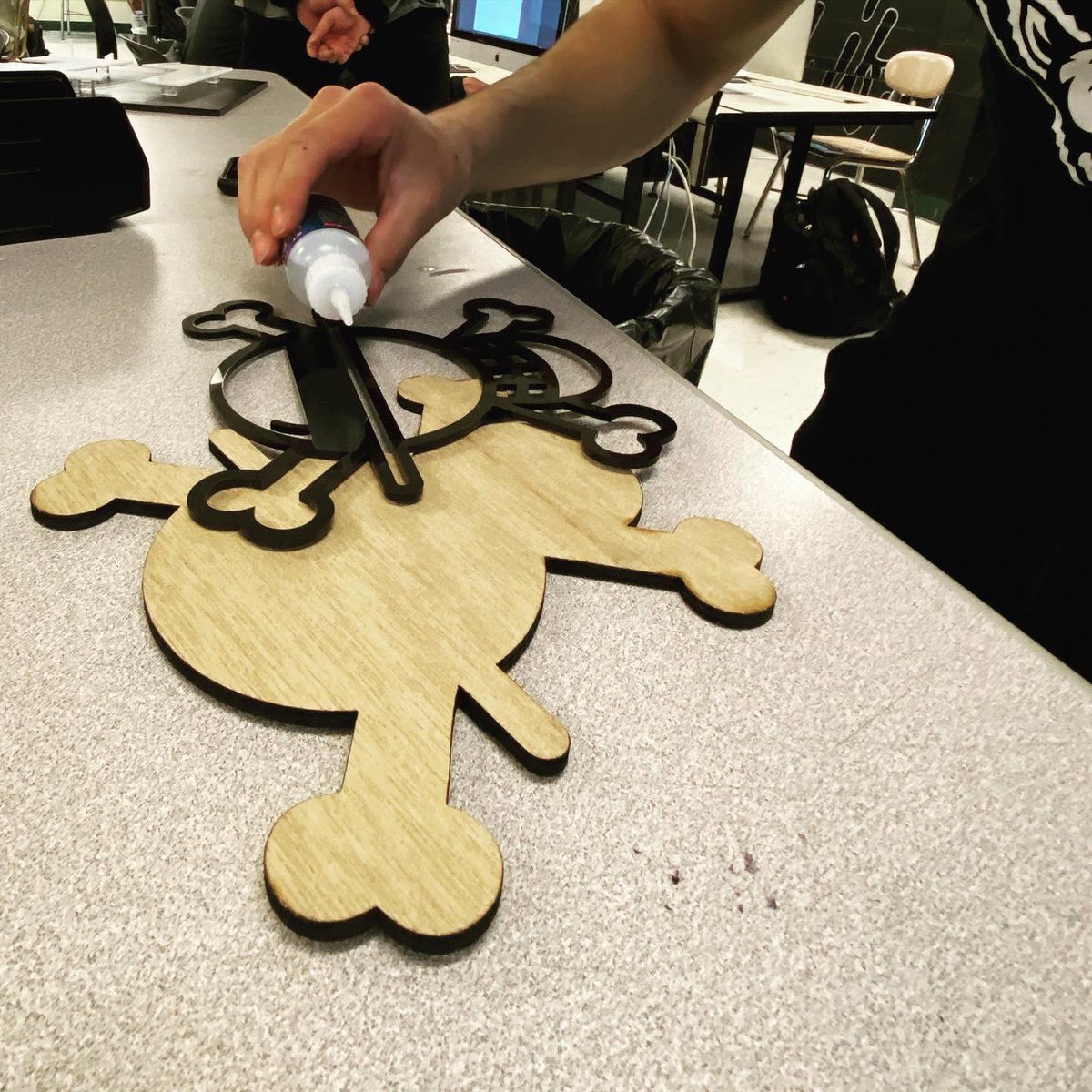 wemakeBHS's tweet photo. My graphic design 4 &amp; 5 took a much needed break from The Brand by working on signage! We are excited for our visit to @rightwaysigns in a few weeks! Students experimented with different materials to create their signage. Josue used black acrylic and wood for his sign https://t.co/YD24PF7vrw