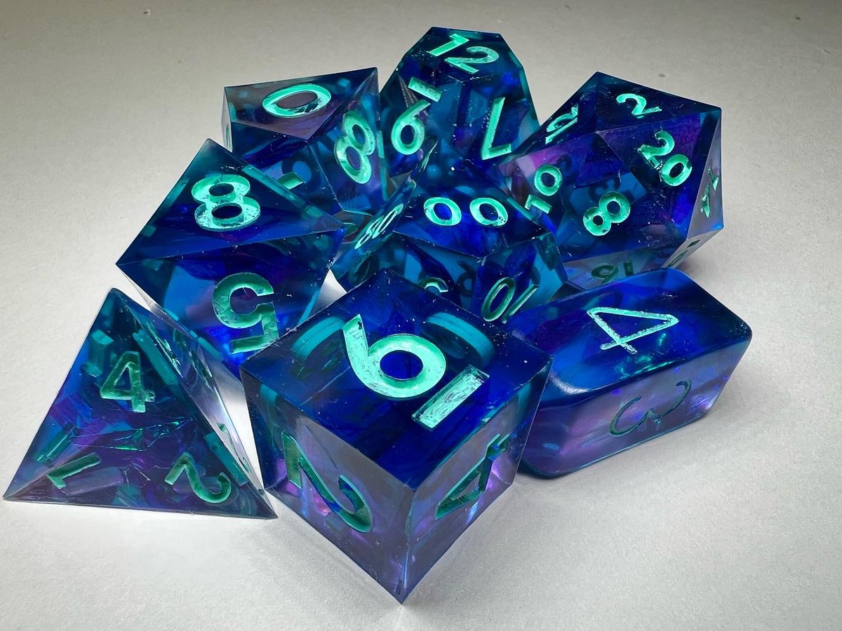 LetoAnimas's tweet photo. Just some of my latest sets! Sorry I keep forgetting to post here😣 #dice #dnd #nerd #handmadedice #ttrpg #resin #sharpedge #shiny https://t.co/H2Lebe60TN