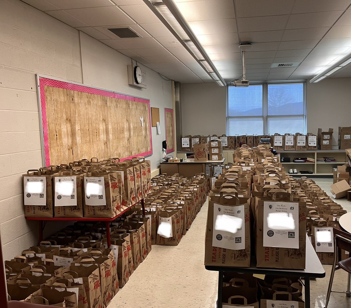 Phew! It was a long day of stuffing bags full of amazing books, stickers, bookmarks, and snacks for families. If this picture doesn’t capture the sheer impact of our program, we’re not sure what will. Close to 1500 new books will be given away for FREE to our community next week!
