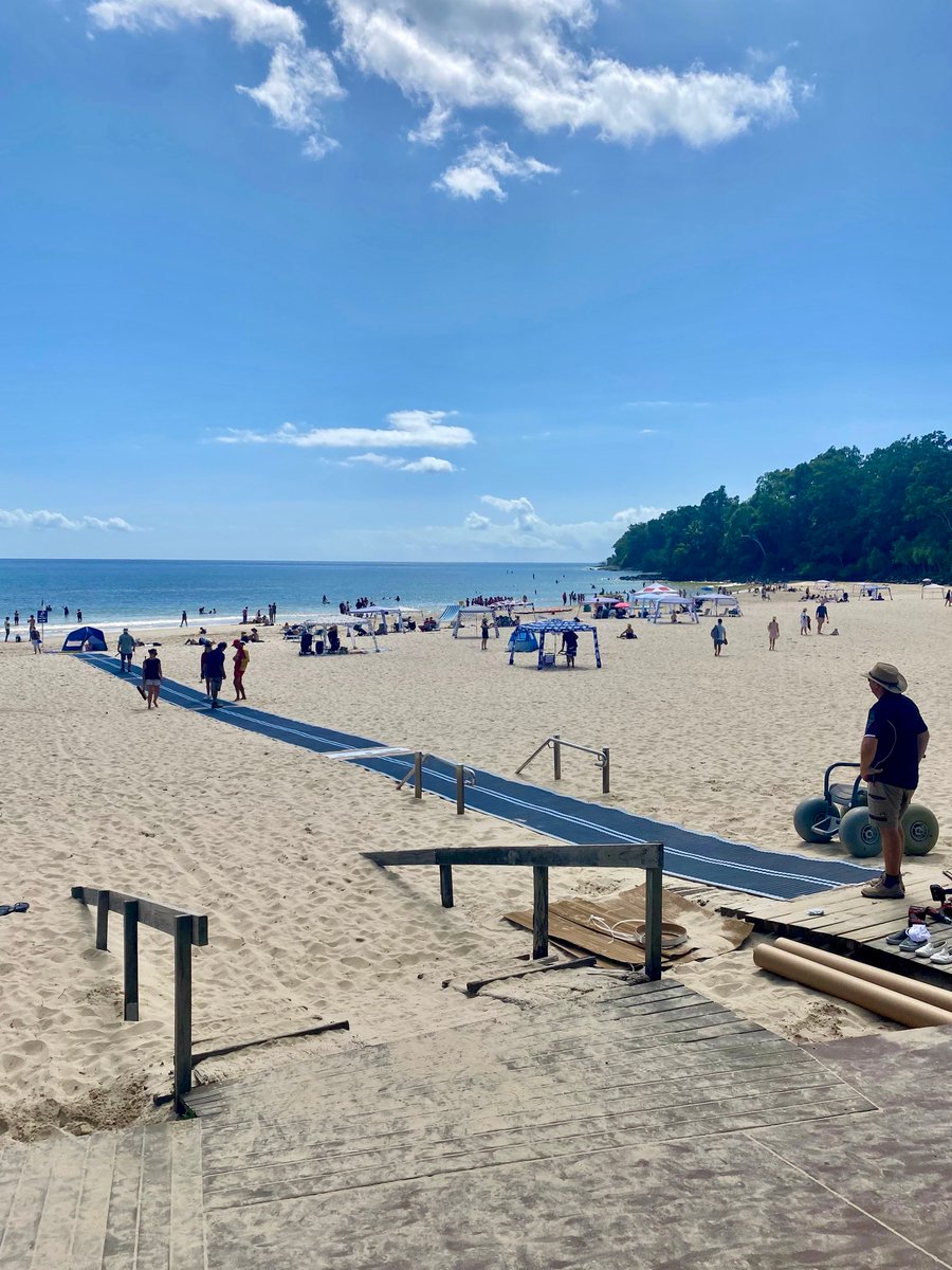 YoungcareOZ's tweet photo. “The new disability mat has been rolled out at Noosa Main Beach!” - Clare Stewart, Noosa Mayor & Youngcare Board Member. A great roll forward in accessibility for one of Queensland’s favourite holiday destinations. #DisabilityIsNormal https://t.co/FPoQVCQ0rm
