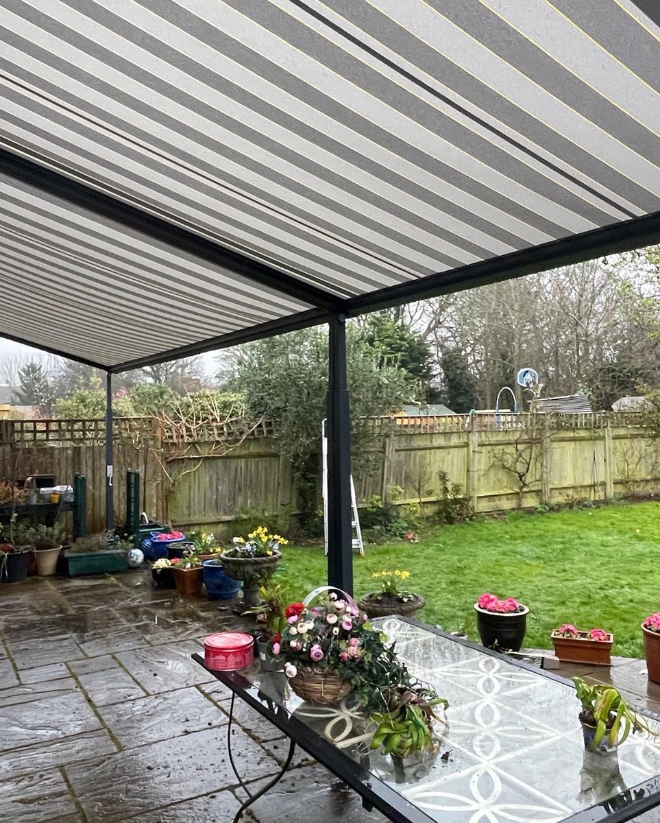 LanaiOutdoor's tweet photo. Two Koa’s covering a total width of 8.25m and a projection of 3m. The frame colour is Anthracite grey to match the bifolding doors, and the fabric selection is striped. Both are operated via remote control.  Please contact us on info@lanai-outdoor.co.uk with any enquiries. https://t.co/7HX84Jhje9