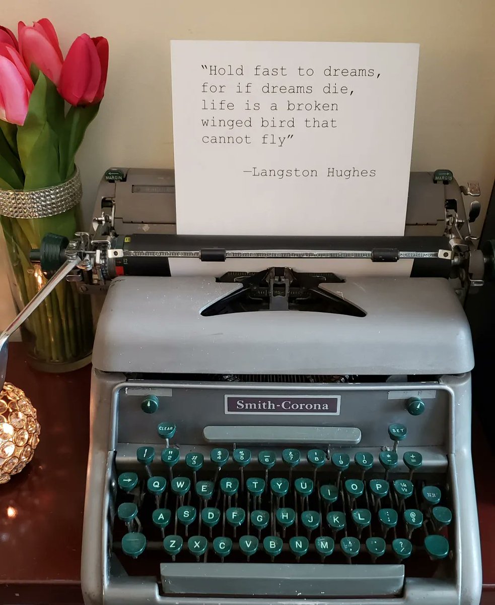 TriceHickman's tweet photo. After years of my vintage typewriter (I named her Belle) being packed away in storage, I finally cleaned her up and put her where she belongs...in my writing cave, right beside my tea station. I inserted one of my favorite quotes as a reminder on those days when I need it. https://t.co/07s4xYJFke