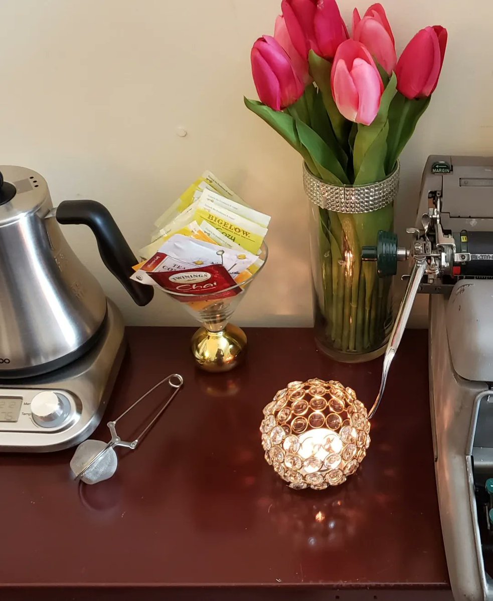 TriceHickman's tweet photo. After years of my vintage typewriter (I named her Belle) being packed away in storage, I finally cleaned her up and put her where she belongs...in my writing cave, right beside my tea station. I inserted one of my favorite quotes as a reminder on those days when I need it. https://t.co/07s4xYJFke