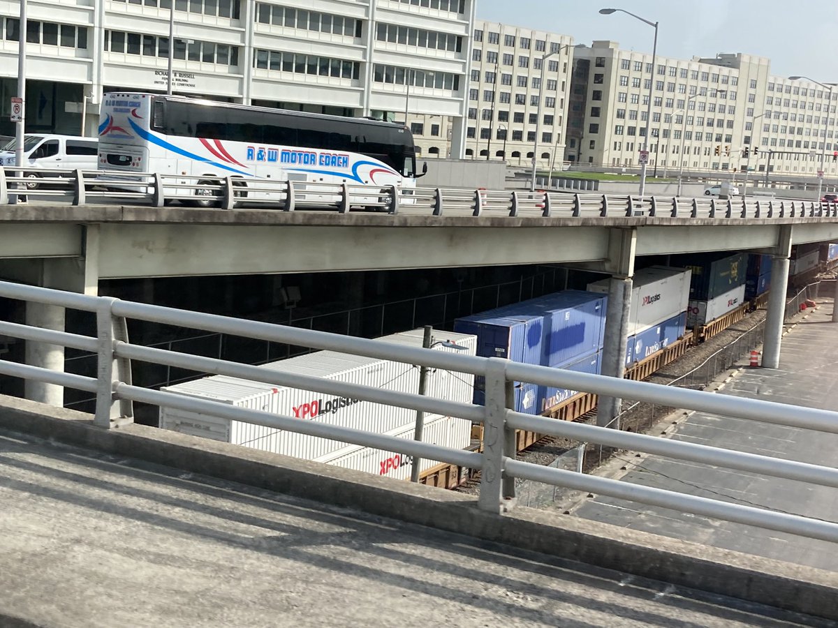 DCVelocity's tweet image. Containers, rails, highways, and buses all cross paths on the morning shuttle to #MODEX2022