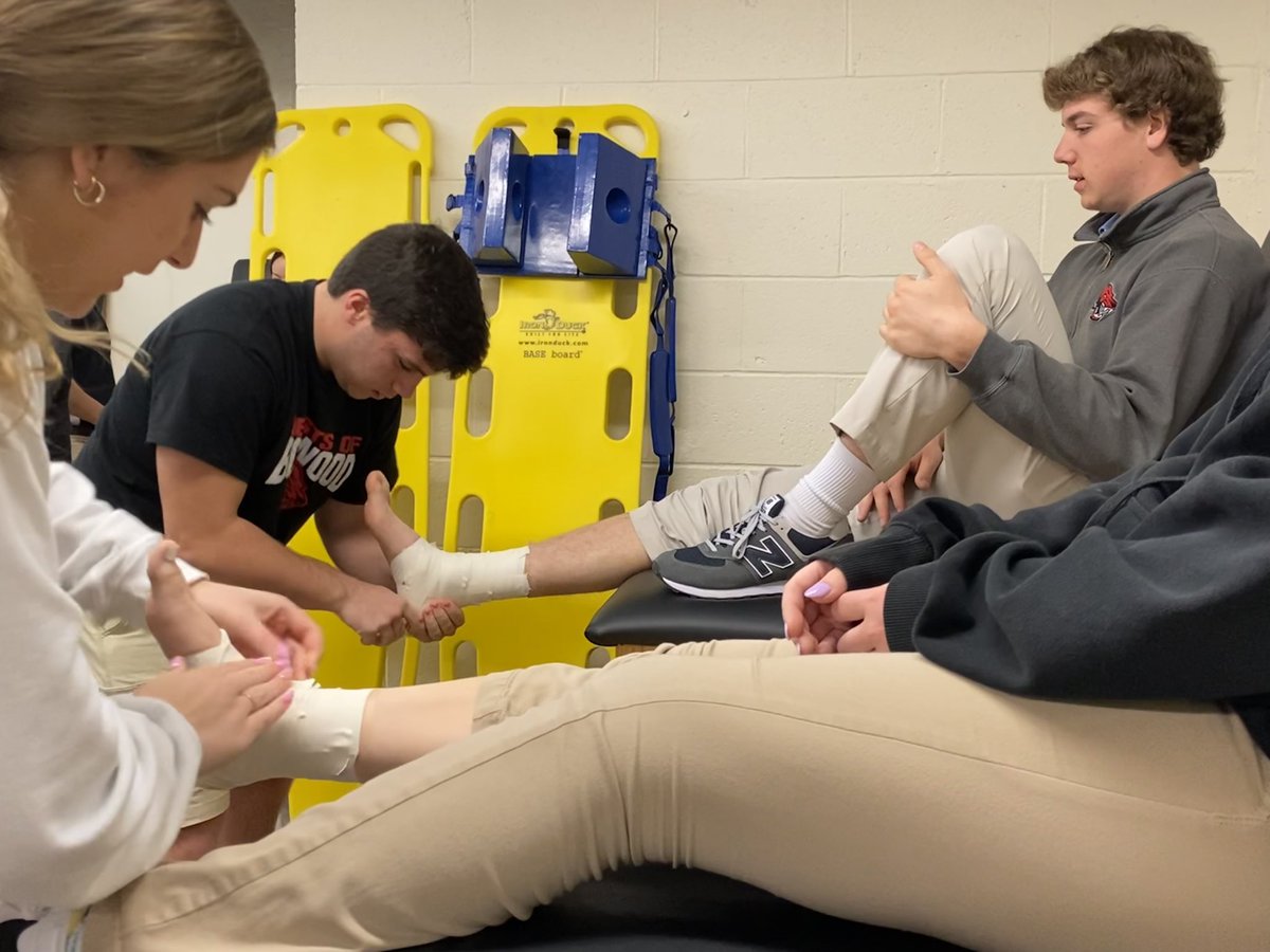 Thank you to our @ATIPT athletic trainer Taylor for speaking with our sophomores and seniors about his journey in athletic training to cap off #NATM2022 ! We ended with Michael winning the ankle taping contest! 💪🙌🏆 @ConradRedWolves