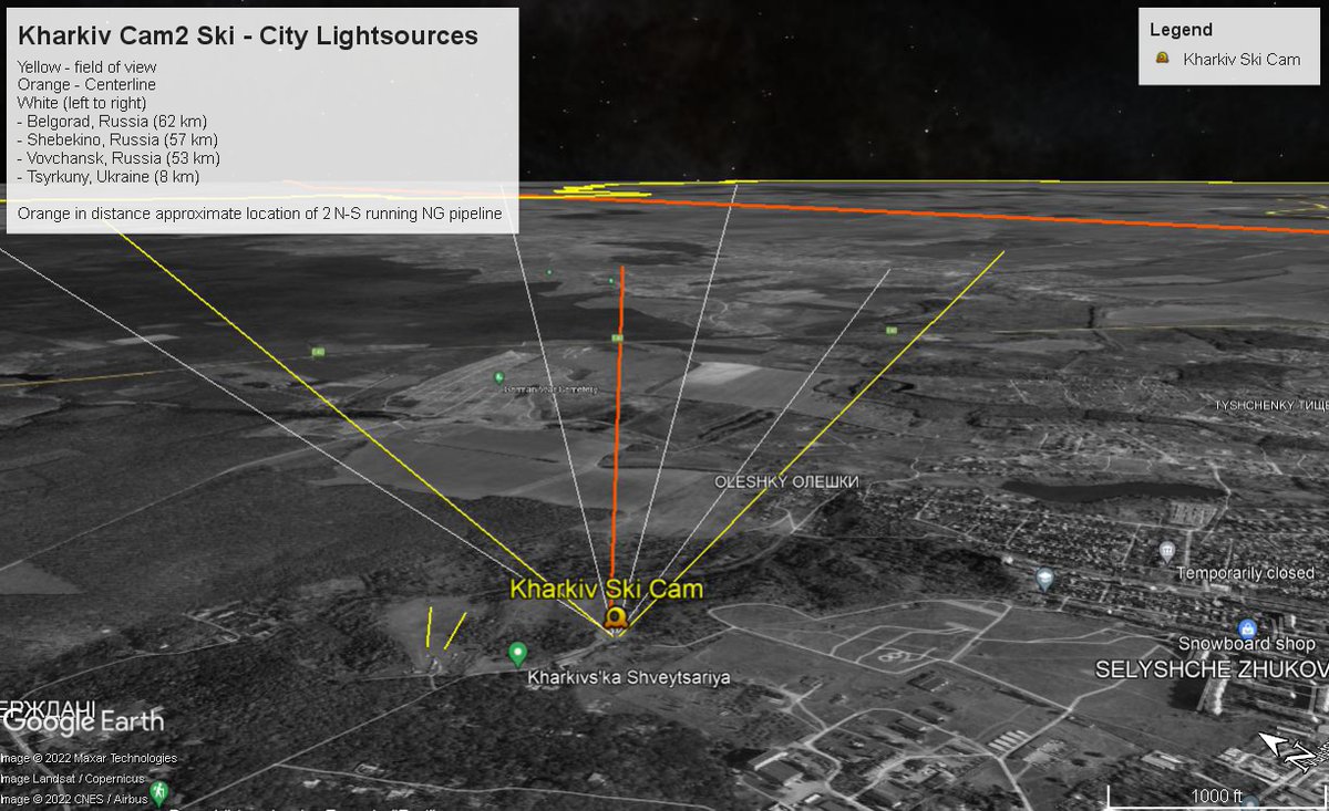 Detailed description of Kharkiv 2 Webcam (ski resort) looking towards Russia.  Low horizon is woods/forests - left side, openland on right side.  Cloud cover often dominates sky.  Here are 4 populated areas were reflected light (off the clouds) can be seen with distances to each.