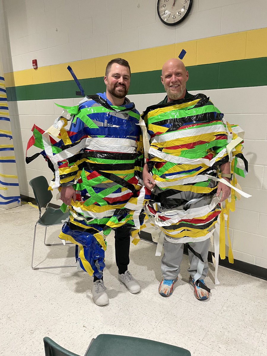 CoachPlympton's tweet photo. Shout out to KP Cares for putting on the Strike Out Cancer event today! Myself and Coach Lee got taped to the wall during lunch! Varsity squad jumped on their chance to tape their coach to the wall! https://t.co/uQ4vuSZCsV