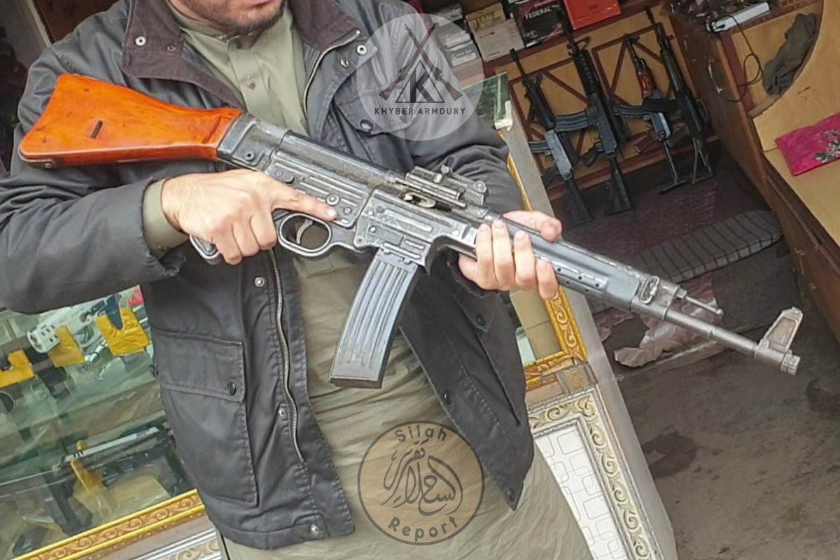 Abdullah handling very nice example of an MP44 'Sturmgewehr' in the infamous tribal arms bazar of Darra Adam Khel in ex-FATA/KPK/Khyber Pakhtunkhwa, Pakistan. Note the locally manufactured 20 round magazine inserted which are also sold with them.

Via <a href="/KhyberArmoury/">Khyber Armoury | خیبر آرموری</a>