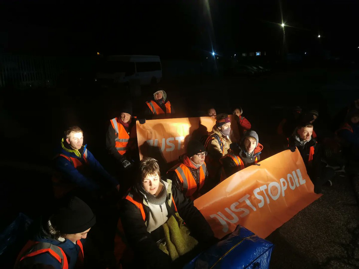 JustStop_Oil's tweet photo. BREAKING: hundreds of supporters of Just Stop Oil and have blocked 8 key oil terminals accross the UK. They are calling for the UK Government to stop all funding of new oil lisences and exploration. Follow the the link in our bio to find out more and get involved! #JustStopOil https://t.co/Ev4EleN7Mb
