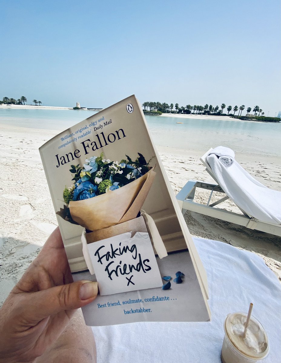 SarahOnAnIsland's tweet photo. Time to take a break from real life and enjoy my latest favourite book in beautiful weather โ๏ธ @JaneFallon #FakingFriends #BahrainLife https://t.co/a9j35Pz6Rp