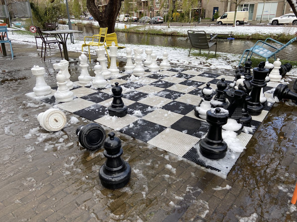 BintheNL's tweet photo. Eh, I’ll post one more snow shot. Okay, slush shot. Here’s how the chessboard at the museum was doing. #Leiden #notsnow https://t.co/DjVDthWLkI