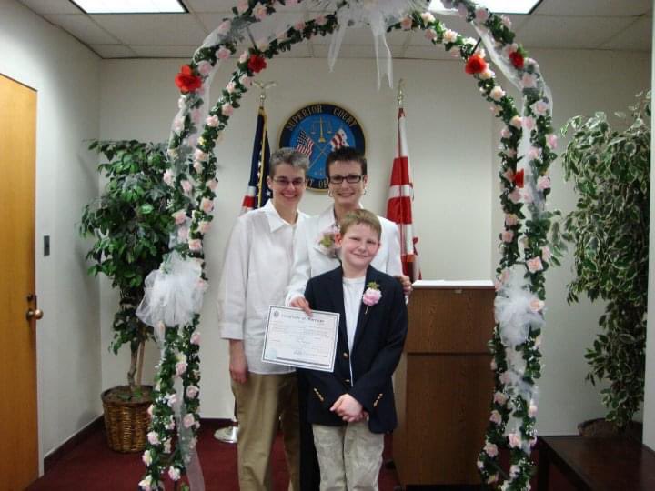 kimacquaviva's tweet photo. Today is April Fools Day, AKA my wedding anniversary. Kathy and I considered ourselves “married” in 2001 but we made it official when DC legalized same-sex marriage.  @GreyAcquaviva signed as the witness. His classmates made the bouquet for us. 

Life is short. Love big! ♥️ https://t.co/yfQFKSK9lG