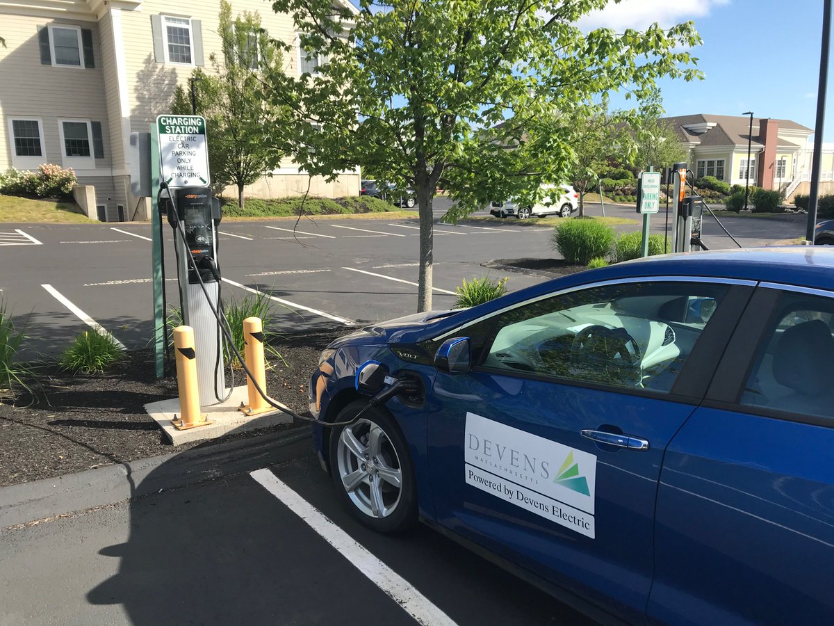 devensec's tweet photo. Driving an EV is now 5 times cheaper per mile than a ga car. #Devens has 8 free public EV charging stations. Businesses like Comrex, Bristol Myers Squibb , @PathwayKSP &amp; @CFS_Energy are also investing in charging for employees. Find your charging station: https://t.co/aMWyqWKaDO https://t.co/FDSP84QkLy