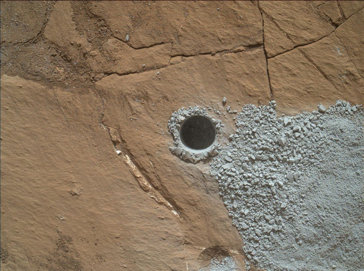 A little dime-size hole drilled on Mars by NASA’s Curiosity Rover. One day holes like this will have ropes around them with little plaques next to them explaining that this is from the pre-colonization era. By then Curiosity will be on display in Mars’s Air and Space Museum.