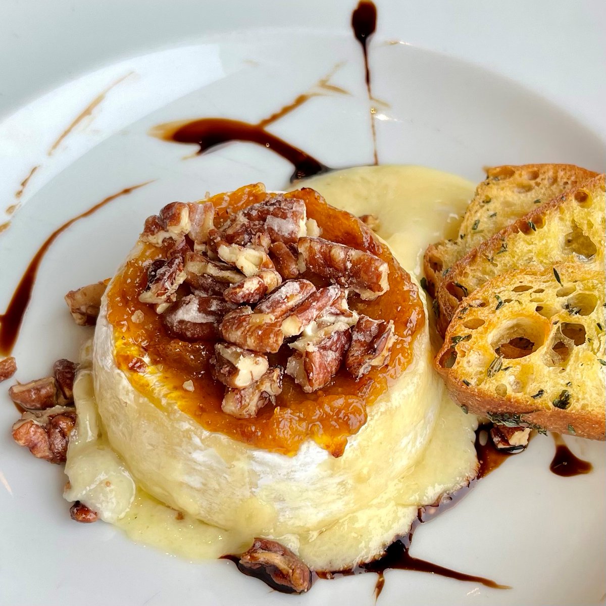 We have added some new items to our In-Room Dining Menu! Try the Warm Baked Brie, topped with a spicy apricot glaze, candied pecans and served with toasted crostini. 😍