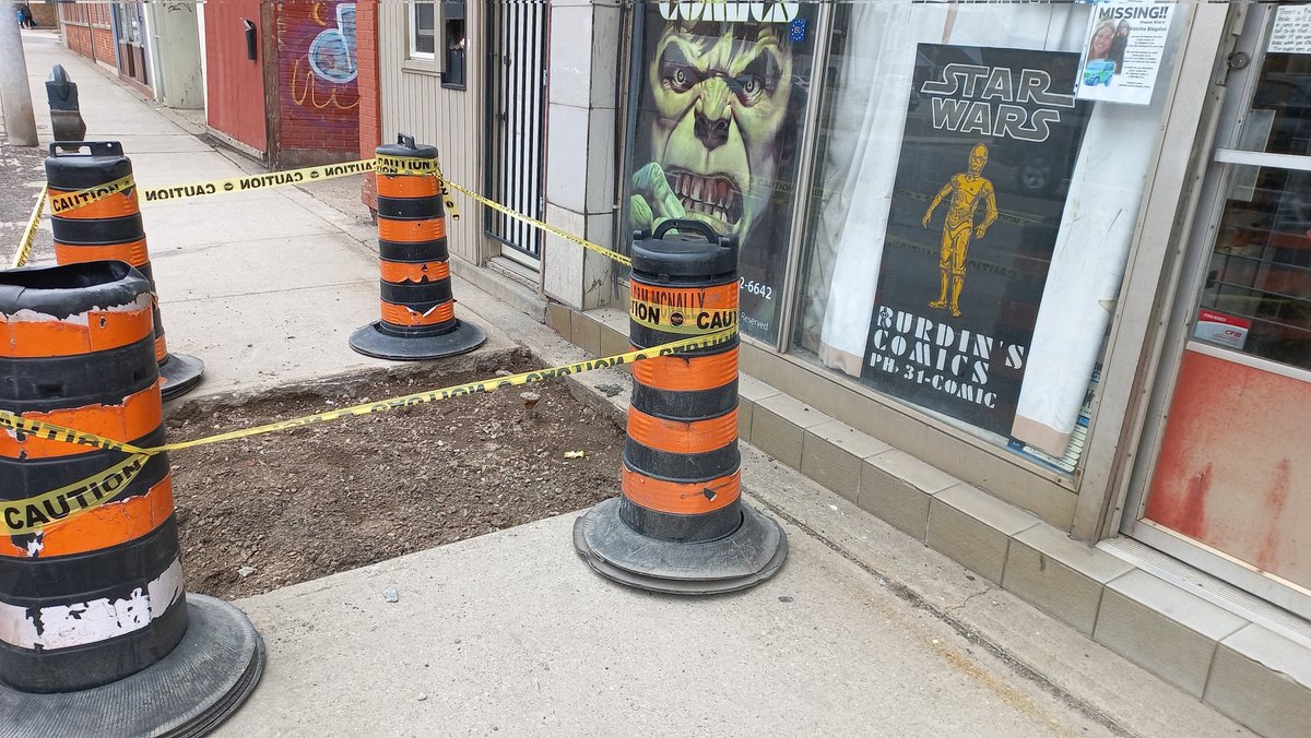 burdinscomics's tweet photo. Open until 8pm. Don't let this big scary hole in front of the store deter you. Unless.... lawsuit! It's not like it's lit up well. Hmmm.... #hole #undercontruction #SafetyFirst #HamOnt #lawsuit #Hamilton #comicbooks https://t.co/klMA4AdvZl