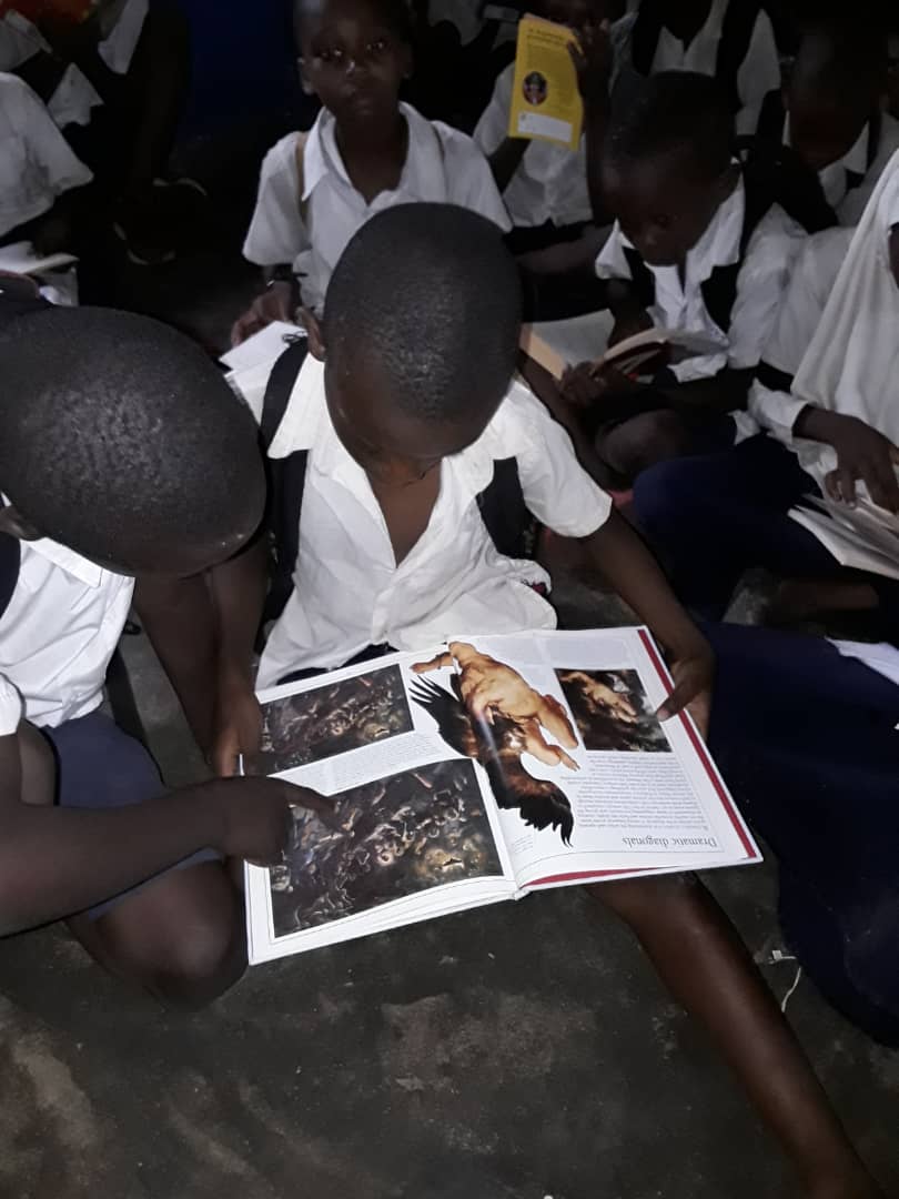 EdUKaid's tweet photo. The children at Mnaida Primary are making good use of the books donated by their link school - @Birchensale Middle School in #Redditch.  These books will help prepare the children for the transition to secondary school where subjects are taught in English.

#schoollink #reading https://t.co/ayQjvGW0Wo