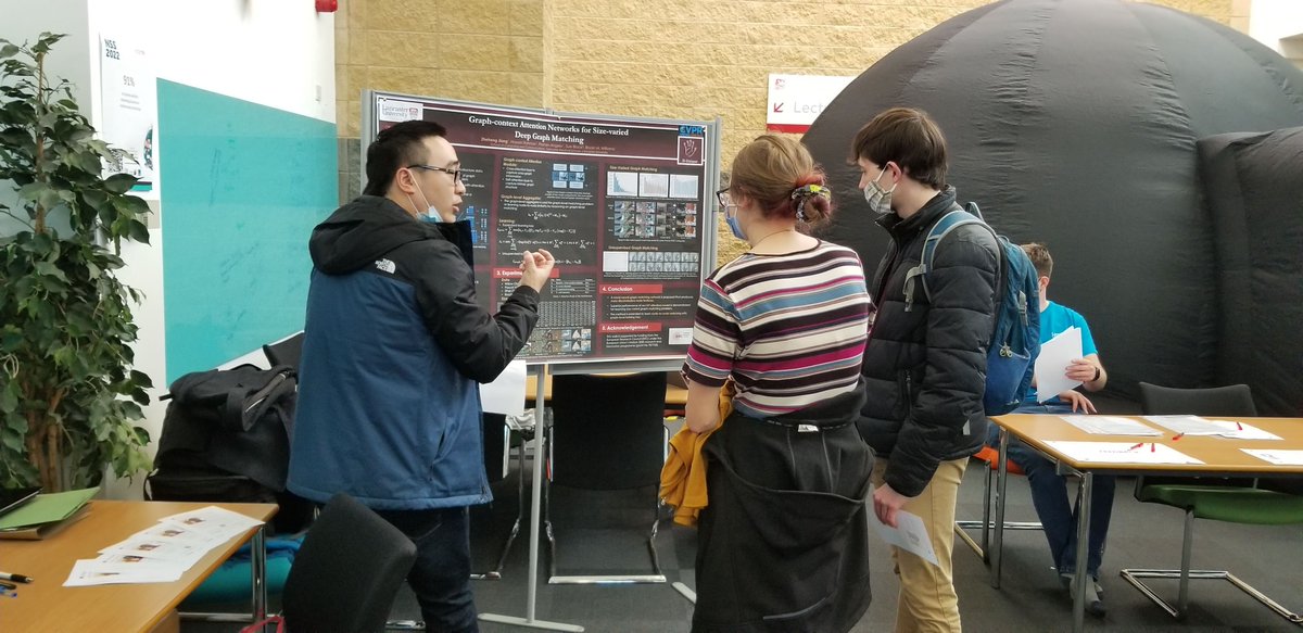 HUniqueProject's tweet photo. Zheheng explaining his work in graph matching with attention and how it relates to vein pattern-based identification on @HUniqueProject to a captivated audience. https://t.co/VjhWbjTptF
