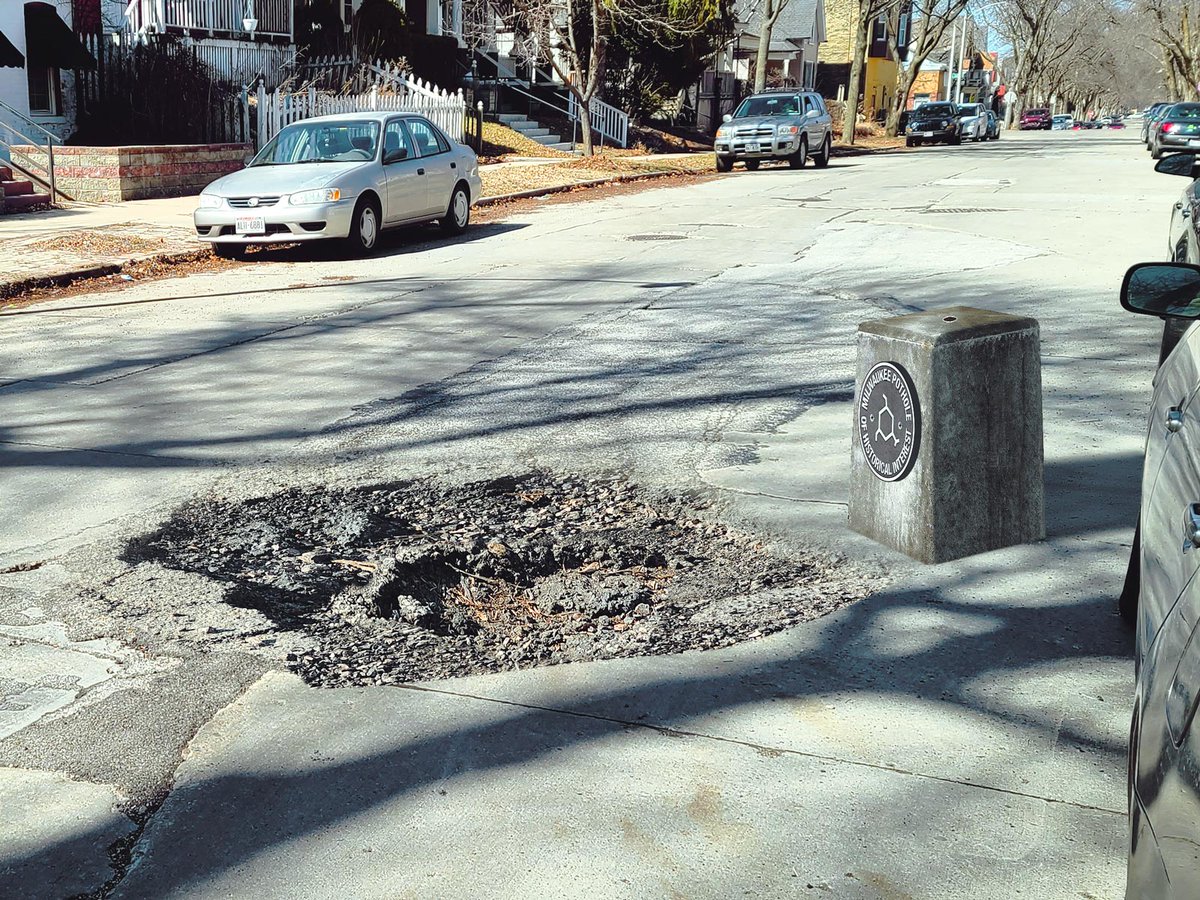 littletinyfish's tweet photo. Whether it's the fact that the pothole survived one repaving, or that it contains additional smaller potholes within, there is a lot to be celebrated about this historic Milwaukee landmark.

https://t.co/NODaOf6UJR https://t.co/xWuHV9YPg3
