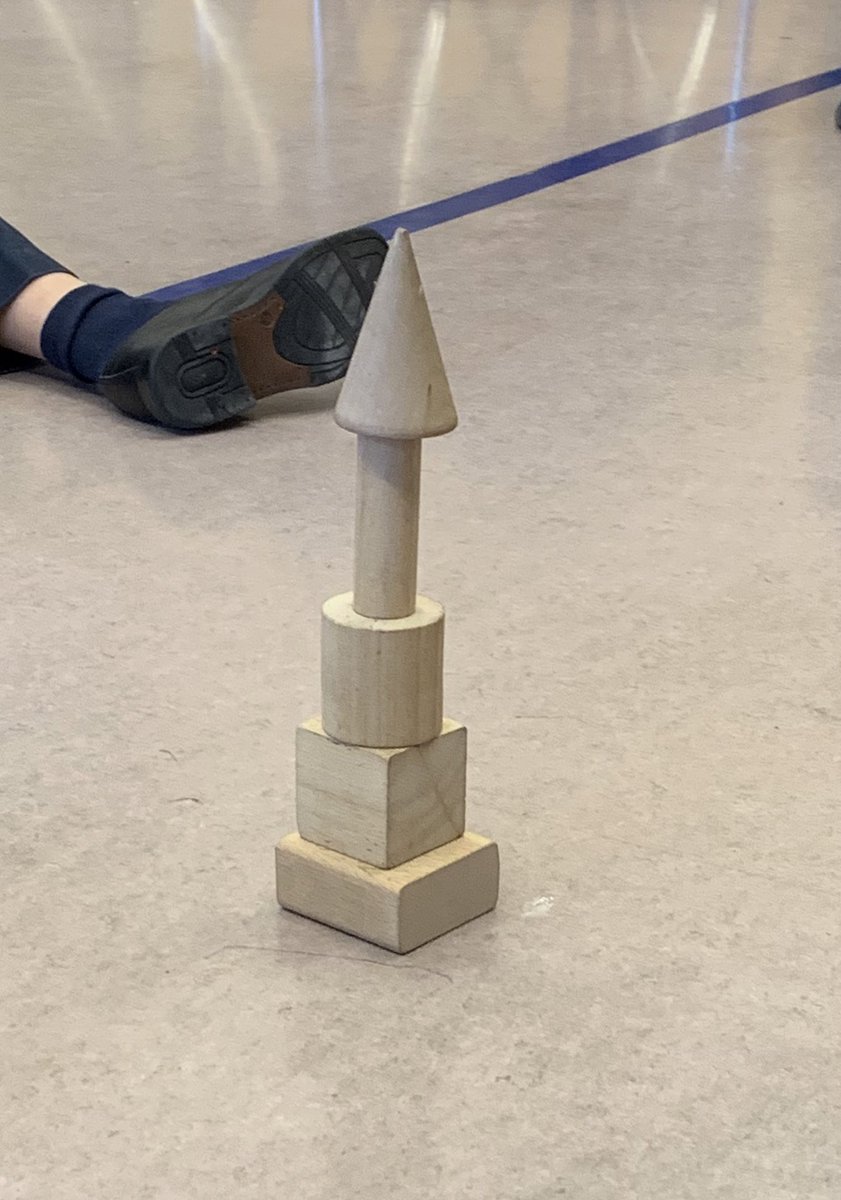 hmparlee's tweet photo. Using 3D objects to construct the tallest tower! @MsBakhtawar spun a wheel that determined the next shape that had to be used while building their towers. What happens when we try to stack something on top of a cone? https://t.co/vwxVs9OiAf