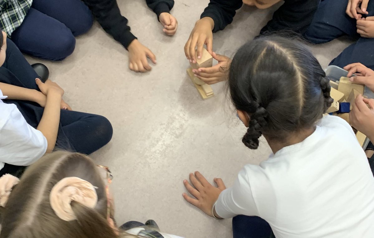 hmparlee's tweet photo. Using 3D objects to construct the tallest tower! @MsBakhtawar spun a wheel that determined the next shape that had to be used while building their towers. What happens when we try to stack something on top of a cone? https://t.co/vwxVs9OiAf
