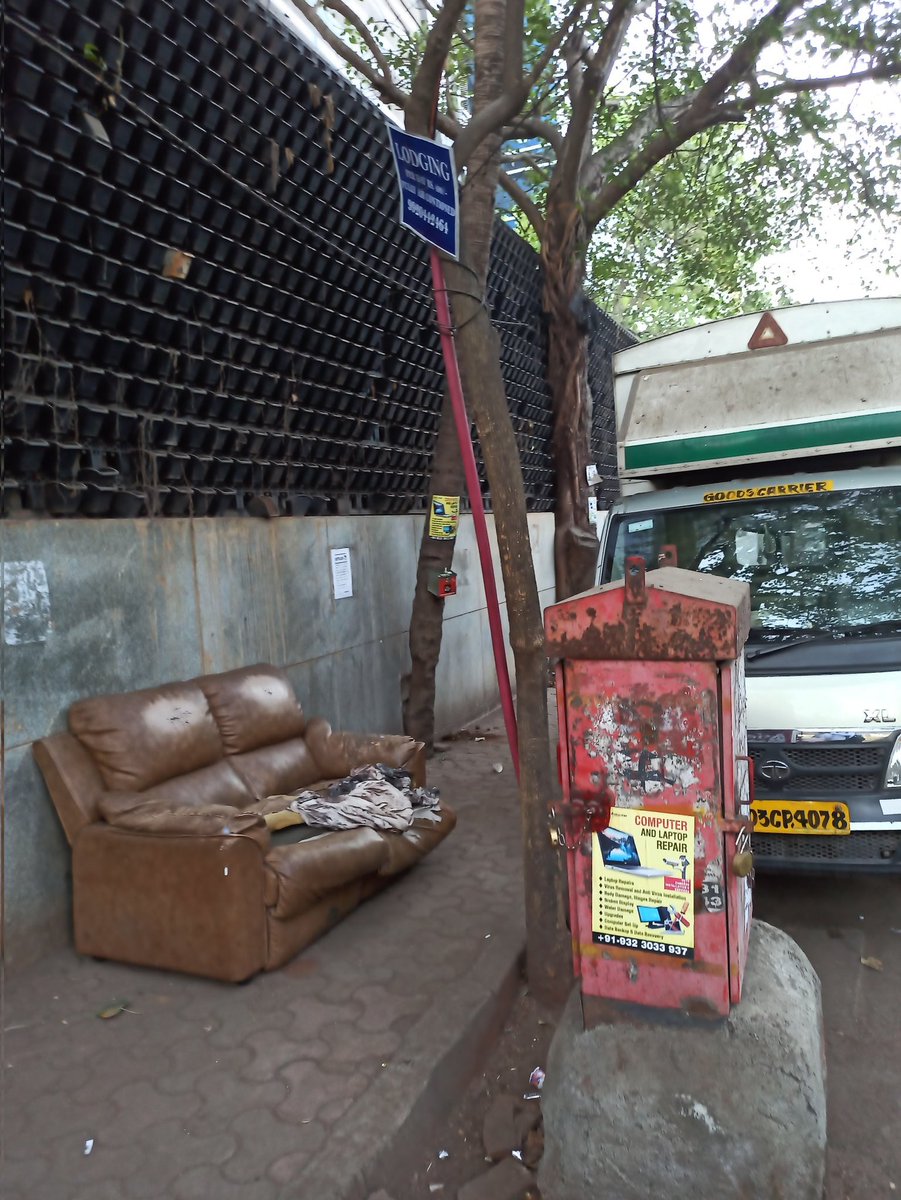 abneesh's tweet photo. Footpath in Windsor lane in Kalina, Santa Cruz east. Vada pav stall has taken up full footpath, uses gas cylinder (banned on street). an old sofa put by truck drivers. Both sides of street have 10 trucks parked at night till 11 am. No space to walk on footpath Or road. Pl help https://t.co/gxDtEB6Vrl